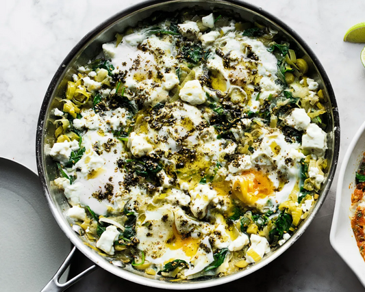 Braised eggs with leeks and za'atar